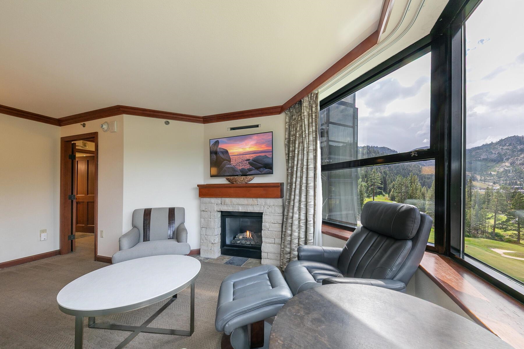 400 Resort Road, Unit 722724 Olympic Valley, CA 96146 - Photo 19 of 28 a living room with furniture and a fireplace