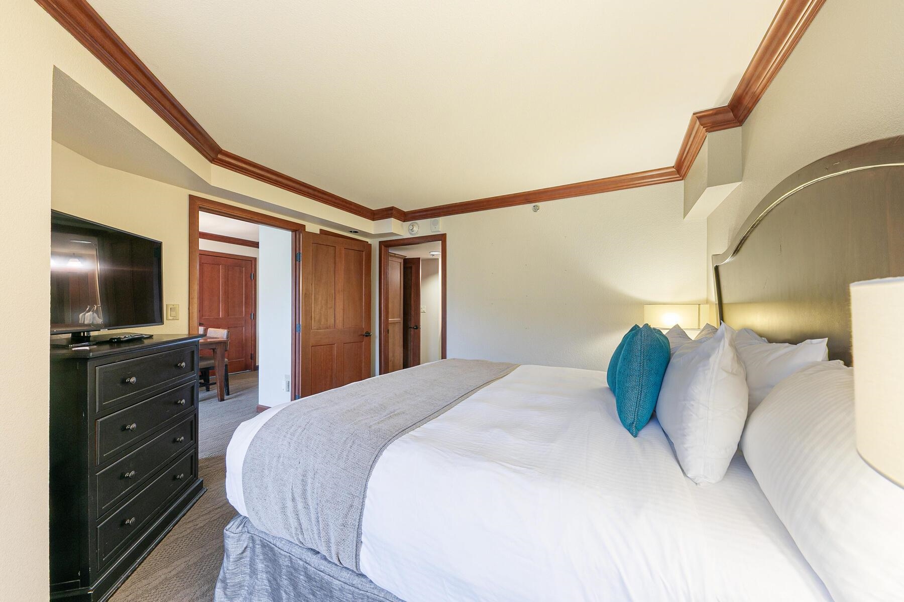 400 Resort Road, Unit 722724 Olympic Valley, CA 96146 - Photo 23 of 28 a bedroom with a bed and a flat screen tv