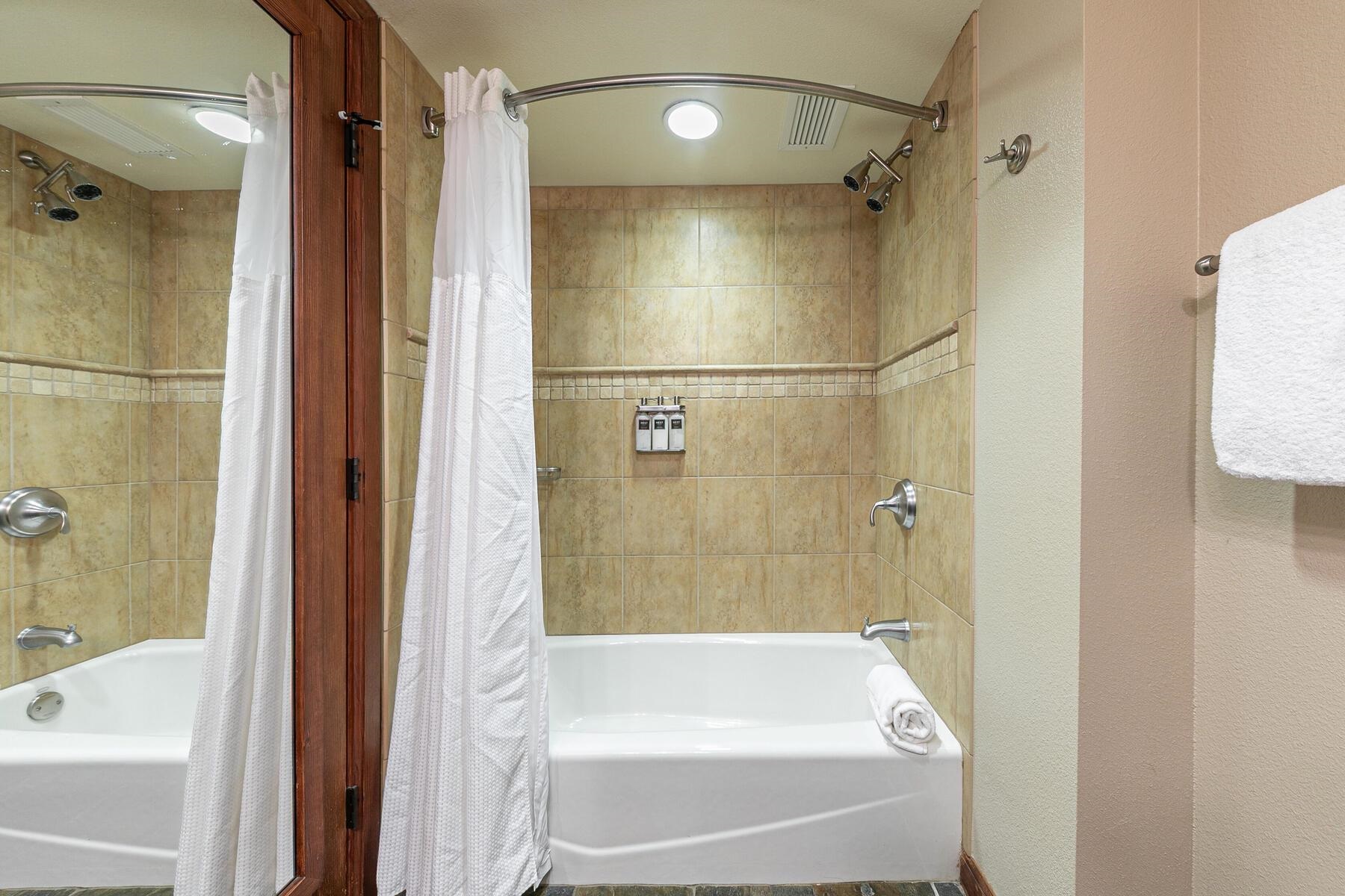 400 Resort Road, Unit 722724 Olympic Valley, CA 96146 - Photo 28 of 28 a bathroom with a bathtub and a shower