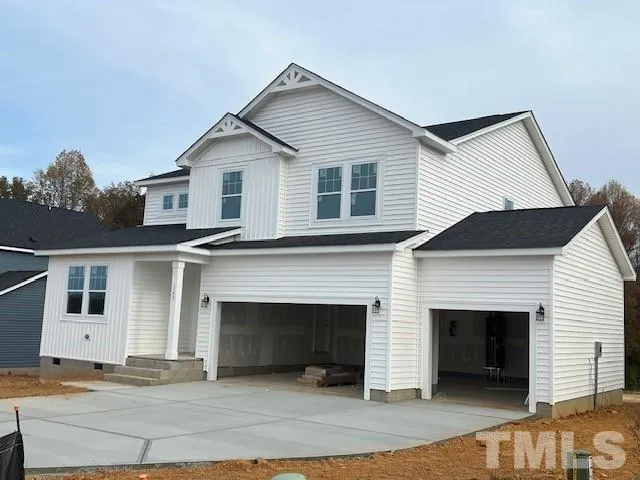 a front view of a house with a garage