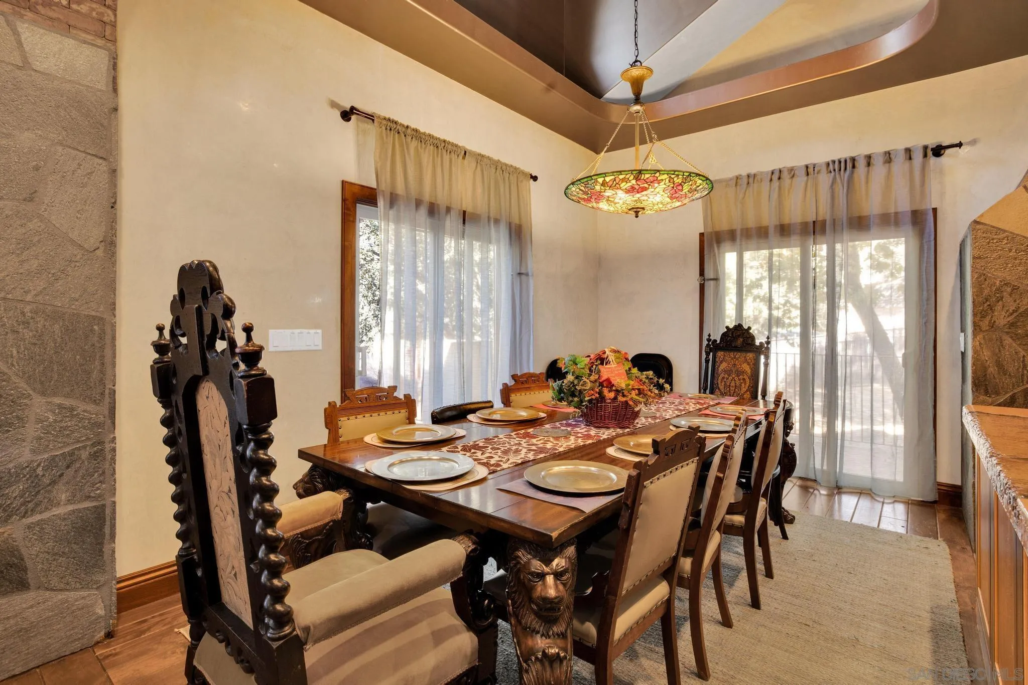 3217 Pera Alta Drive Julian, CA 92036 - Photo 16 of 37 a view of a dining room and livingroom with furniture wooden floor a chandelier