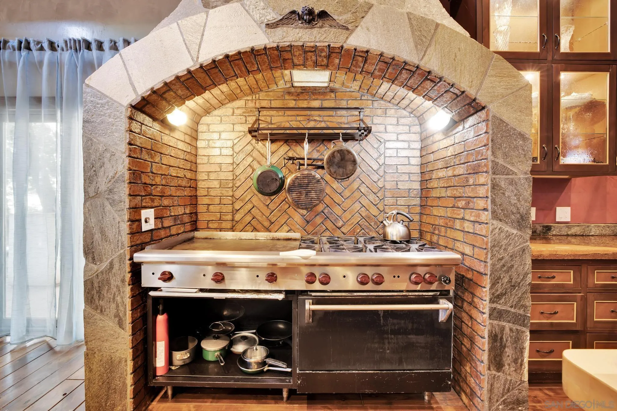 3217 Pera Alta Drive Julian, CA 92036 - Photo 18 of 37 a stove top oven sitting inside of a kitchen