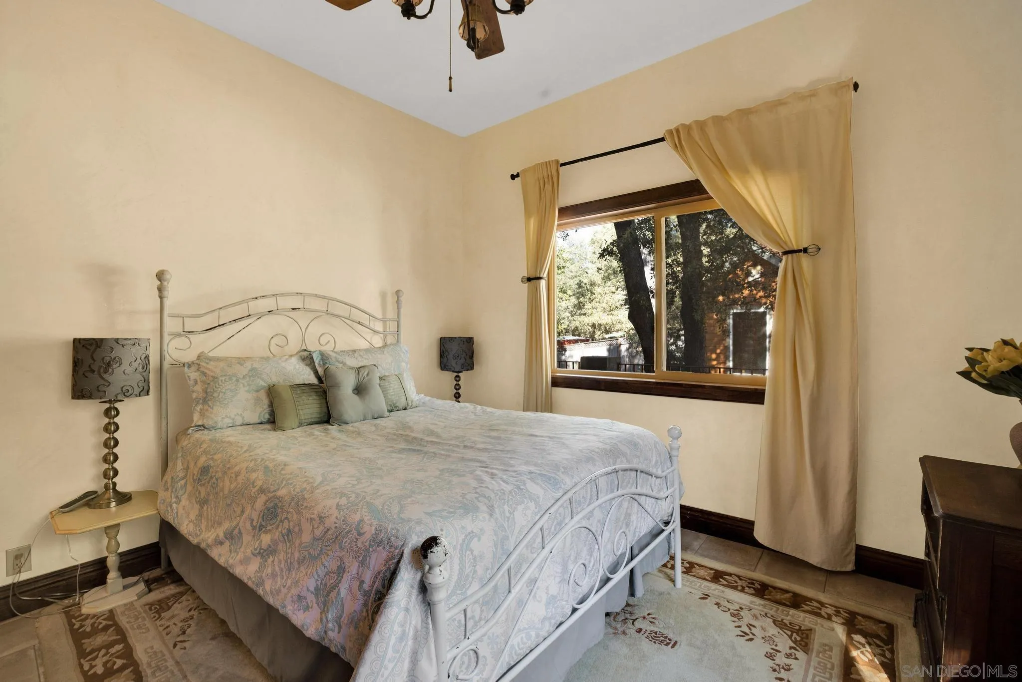 3217 Pera Alta Drive Julian, CA 92036 - Photo 23 of 37 a bedroom with a bed and a window