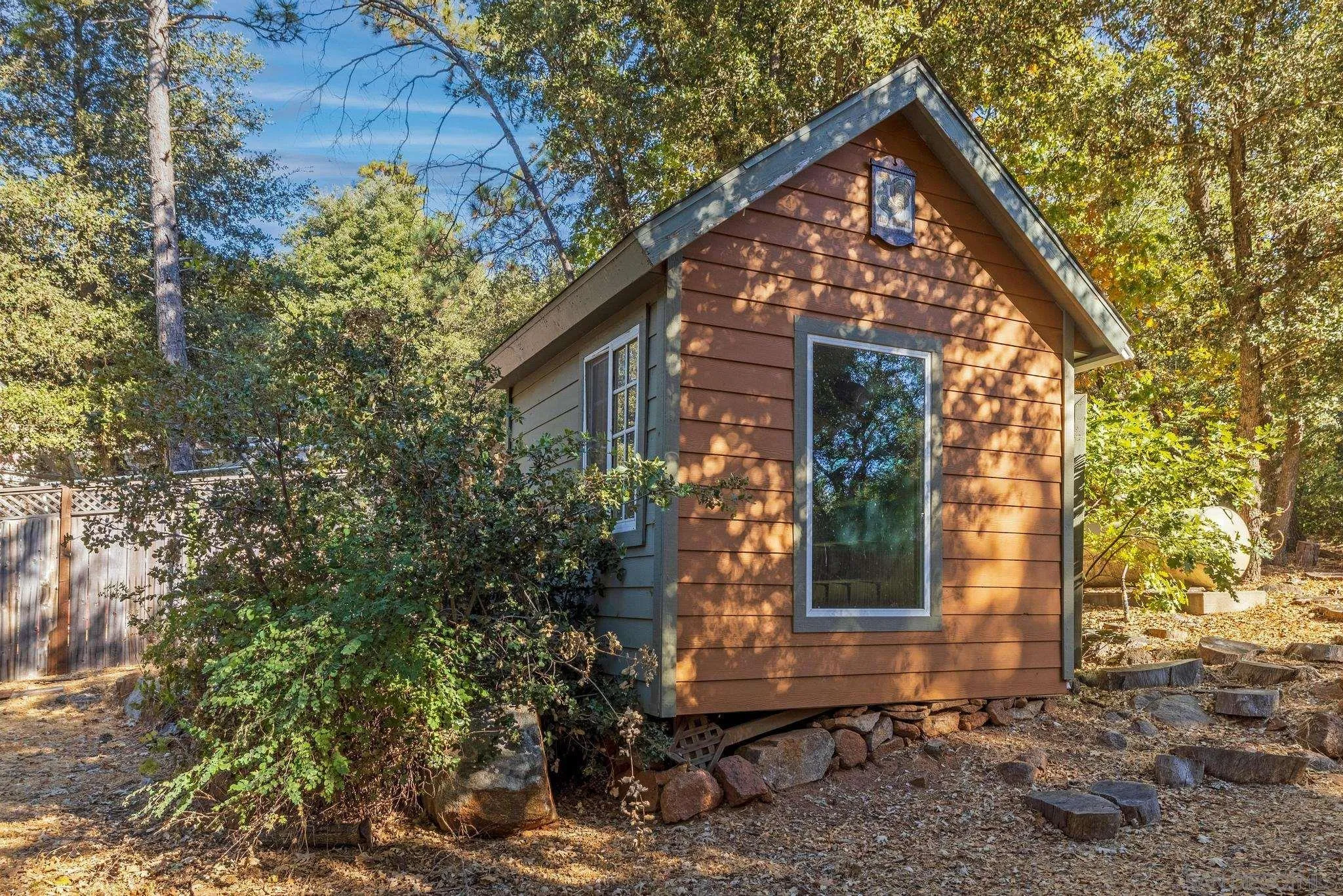 3217 Pera Alta Drive Julian, CA 92036 - Photo 36 of 37 a front view of a house with garden