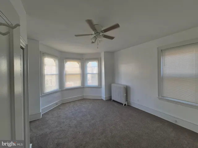 wooden floor and window in an empty room