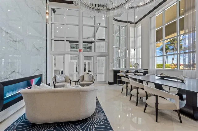 a room with pool table and windows