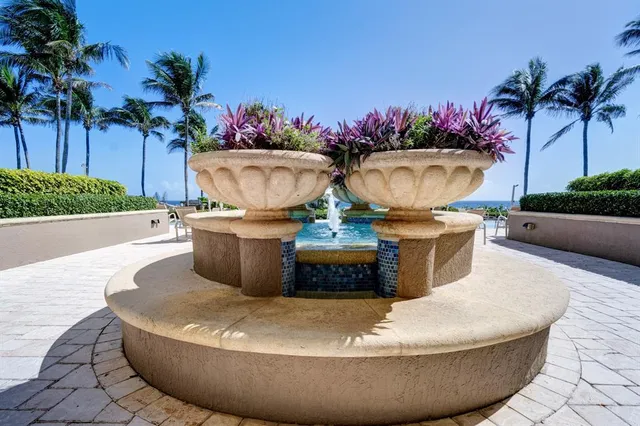 a living room with furniture and large windows