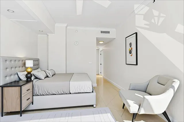 a view of a lake with lawn chairs