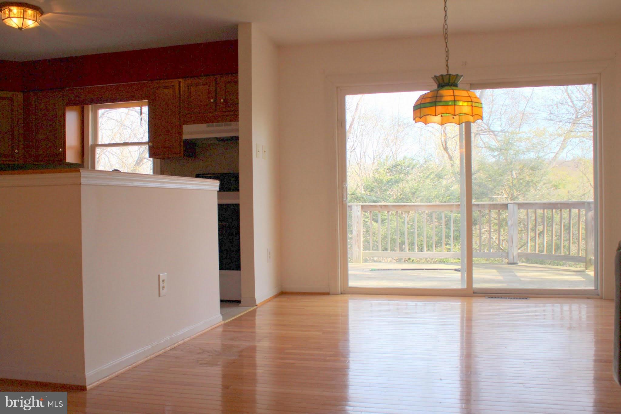 2416 Raintree Avenue Westminster, MD 21157 - Photo 15 of 27 a view of an empty room with window and kitchen view