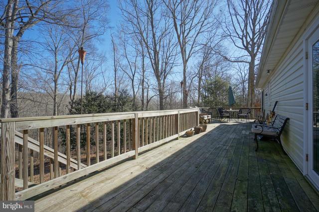 2416 Raintree Avenue Westminster, MD 21157 - Photo 3 of 27 a view of deck with two chairs and wooden floor