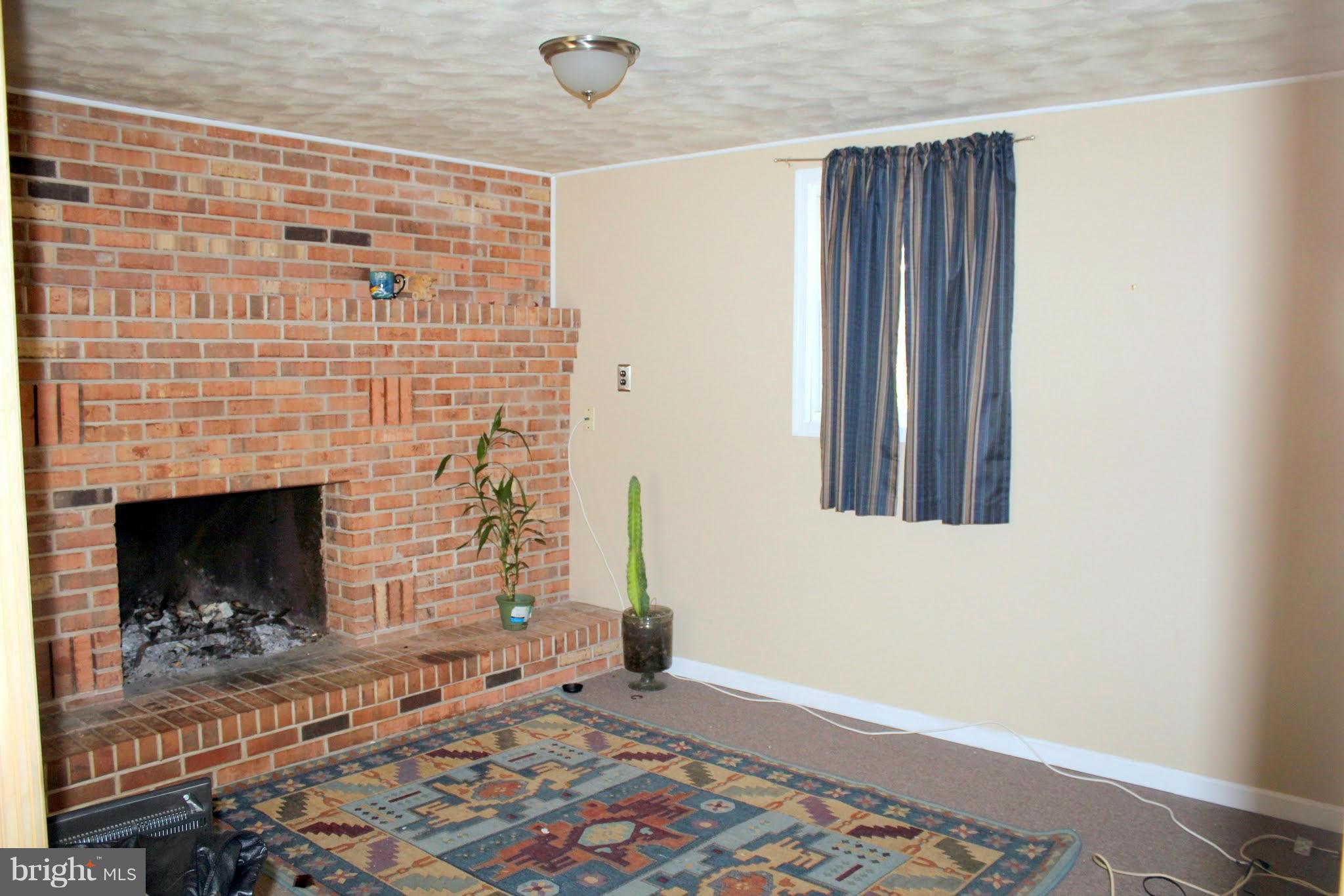 2416 Raintree Avenue Westminster, MD 21157 - Photo 21 of 27 a view of an empty room and fire place