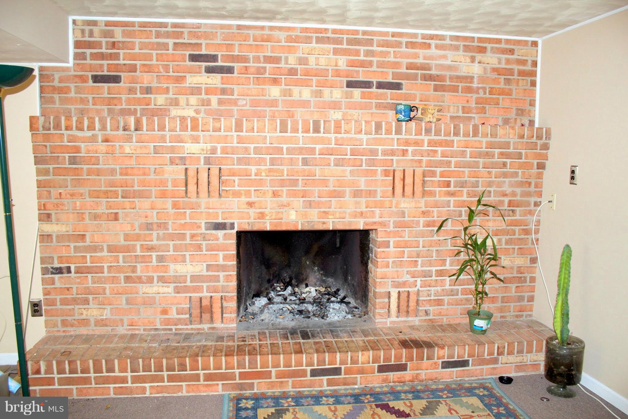 2416 Raintree Avenue Westminster, MD 21157 - Photo 22 of 27 a view of a fireplace with wooden floor