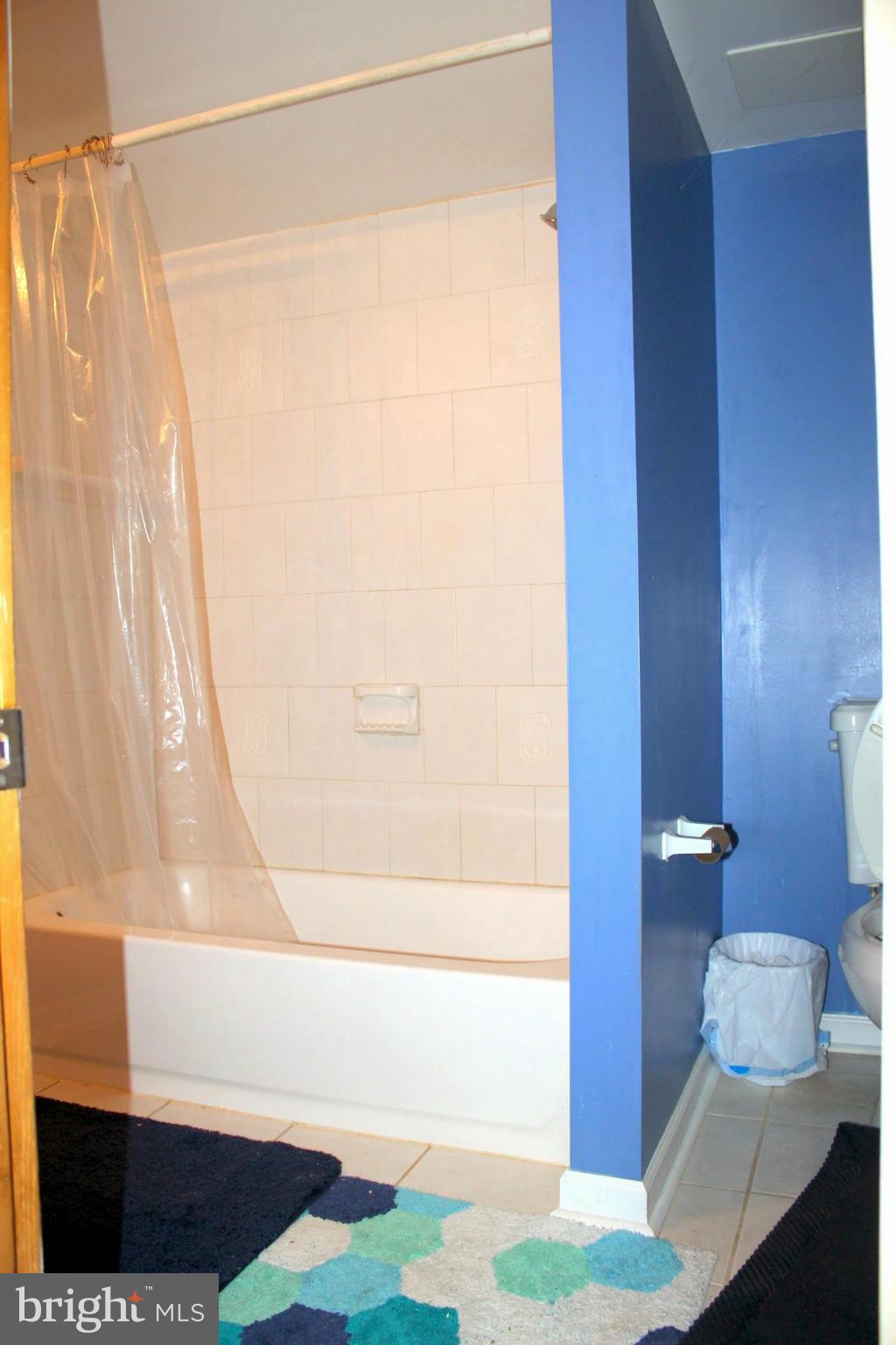 2416 Raintree Avenue Westminster, MD 21157 - Photo 25 of 27 a bathroom with a bathtub and a shower