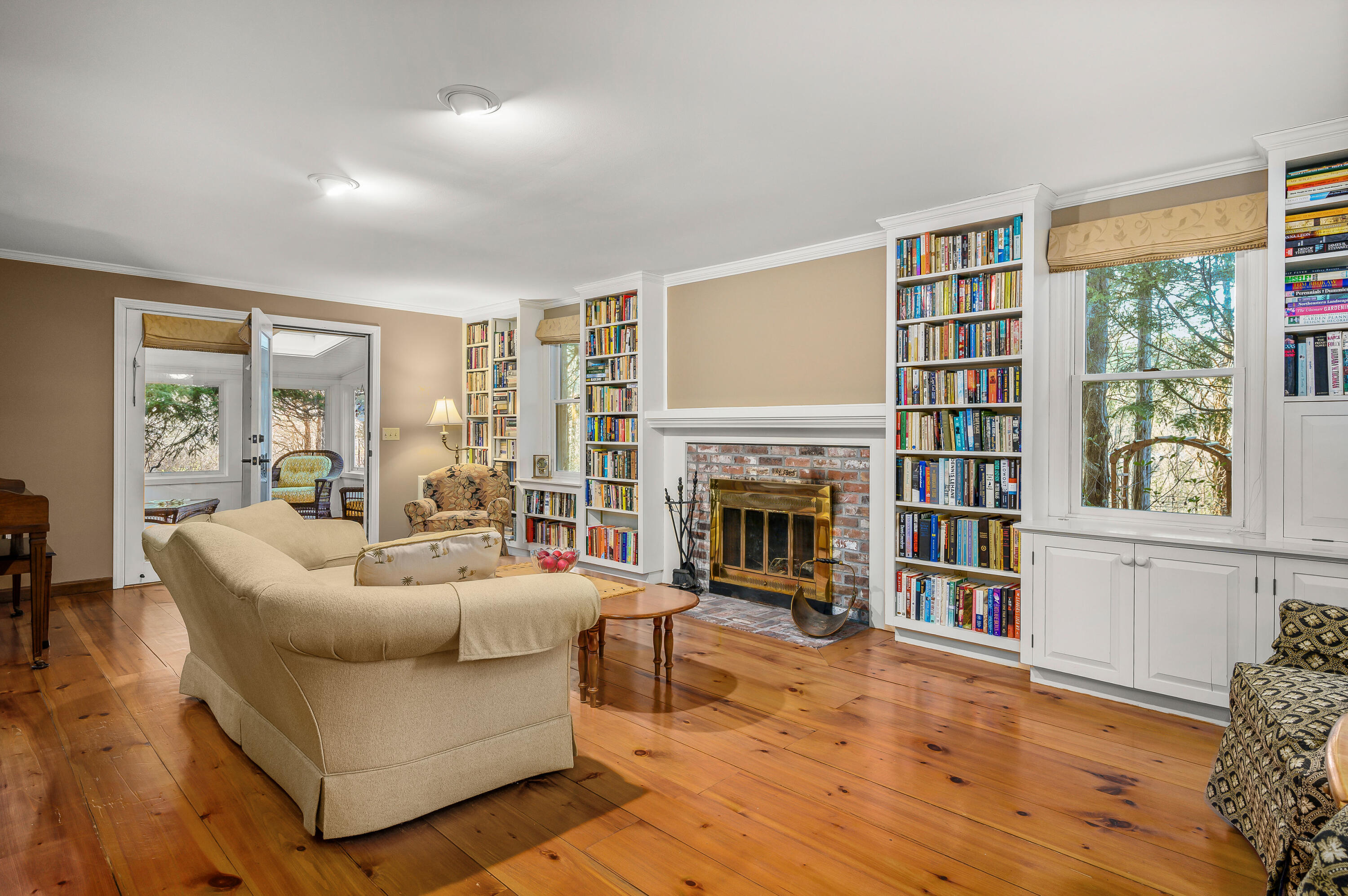24 Blueberry Island Road Orleans, MA 02653 - Photo 11 of 39 a living room with fireplace furniture and a large window