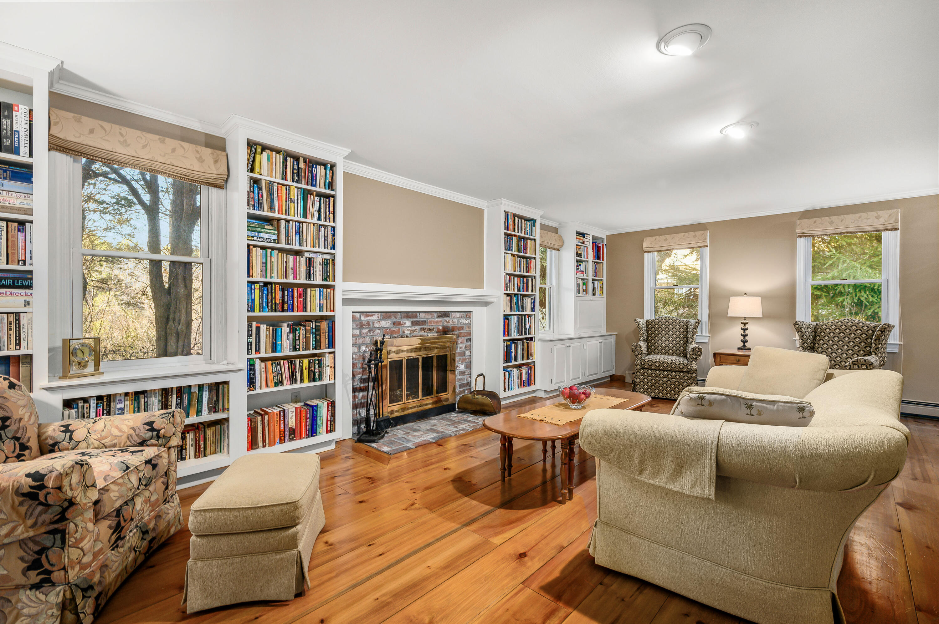 24 Blueberry Island Road Orleans, MA 02653 - Photo 12 of 39 a living room with furniture and a fireplace
