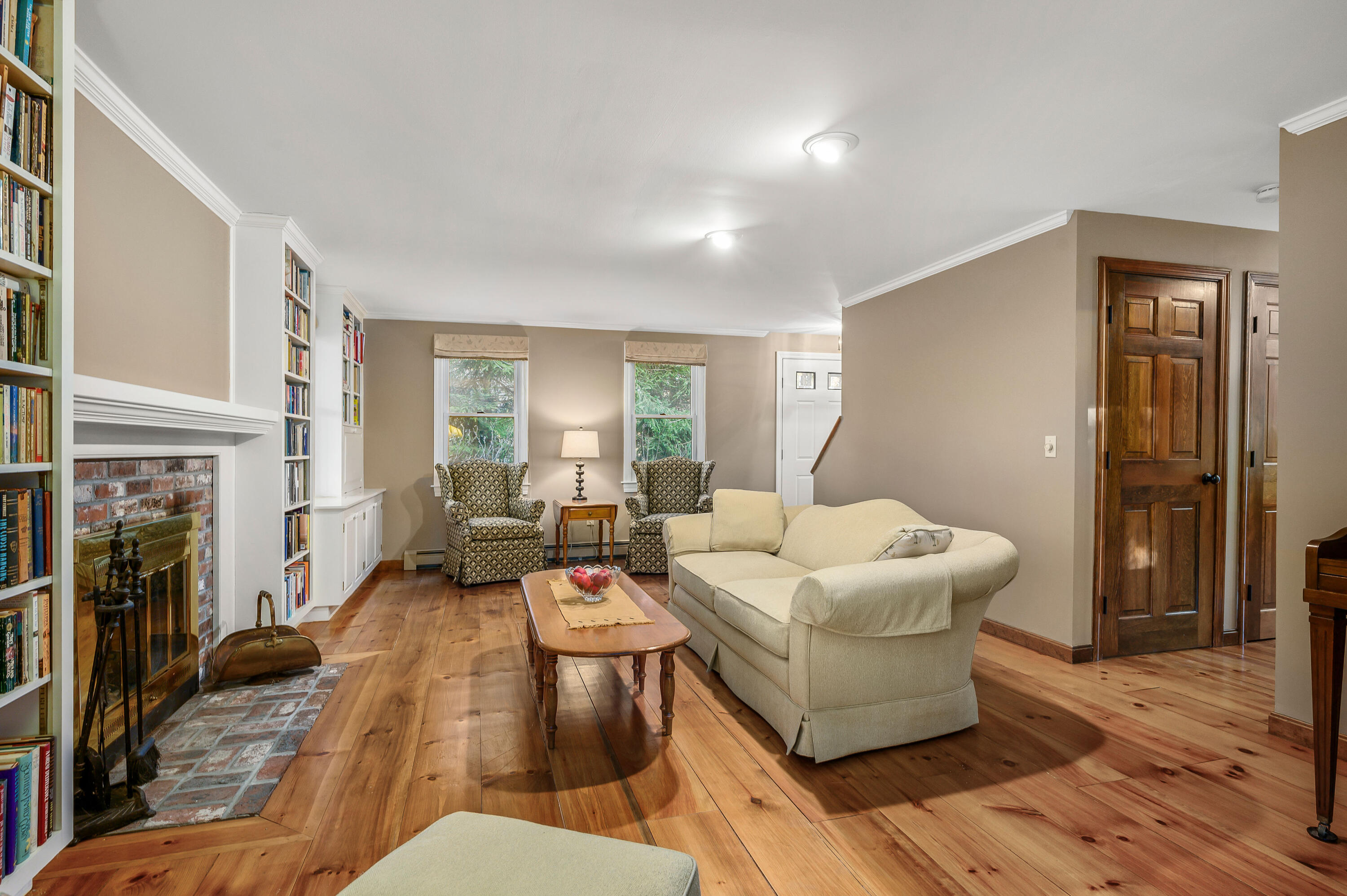 24 Blueberry Island Road Orleans, MA 02653 - Photo 13 of 39 a living room with furniture and a fireplace