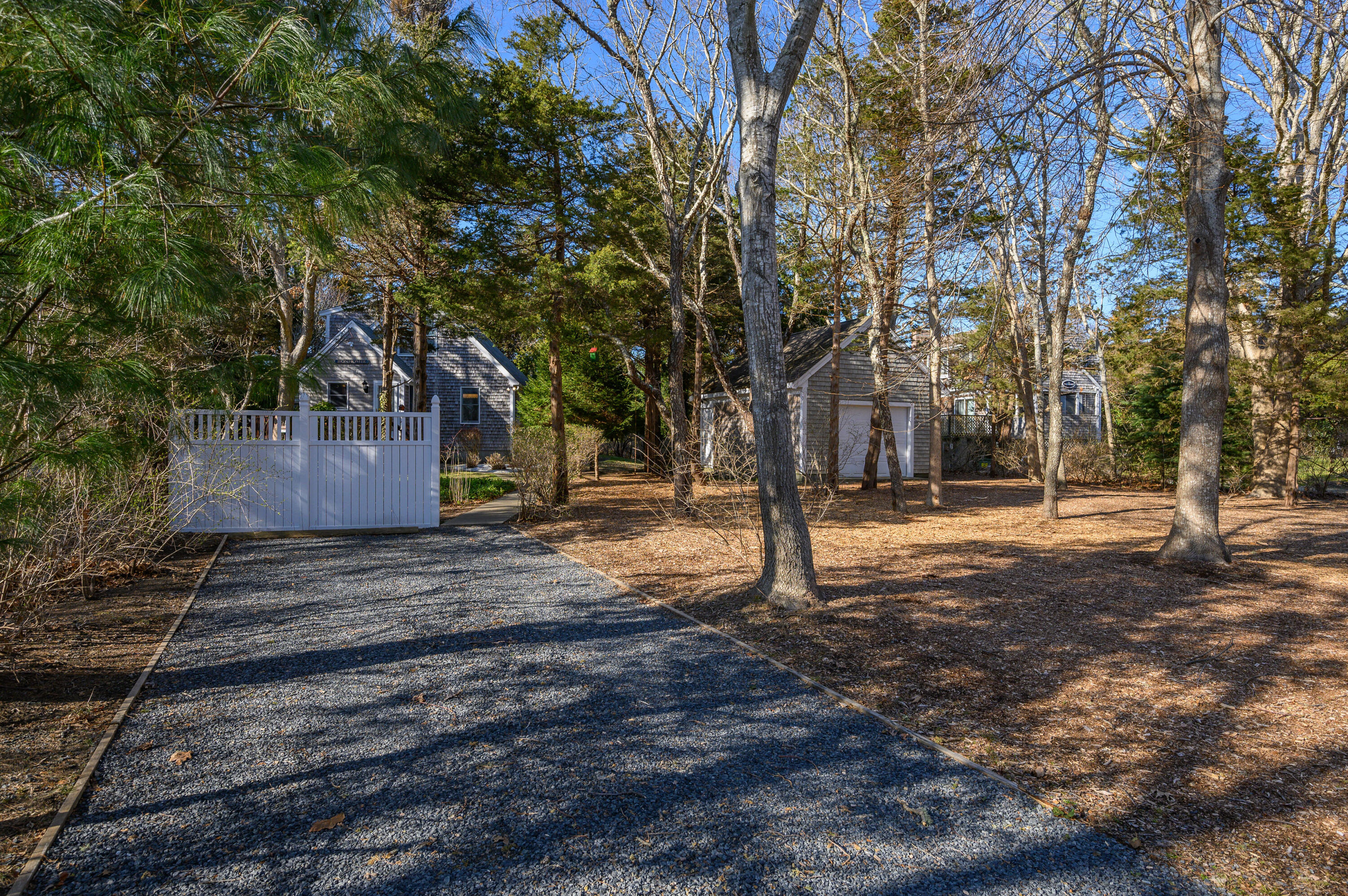 24 Blueberry Island Road Orleans, MA 02653 - Photo 34 of 39 a backyard of a house with trees