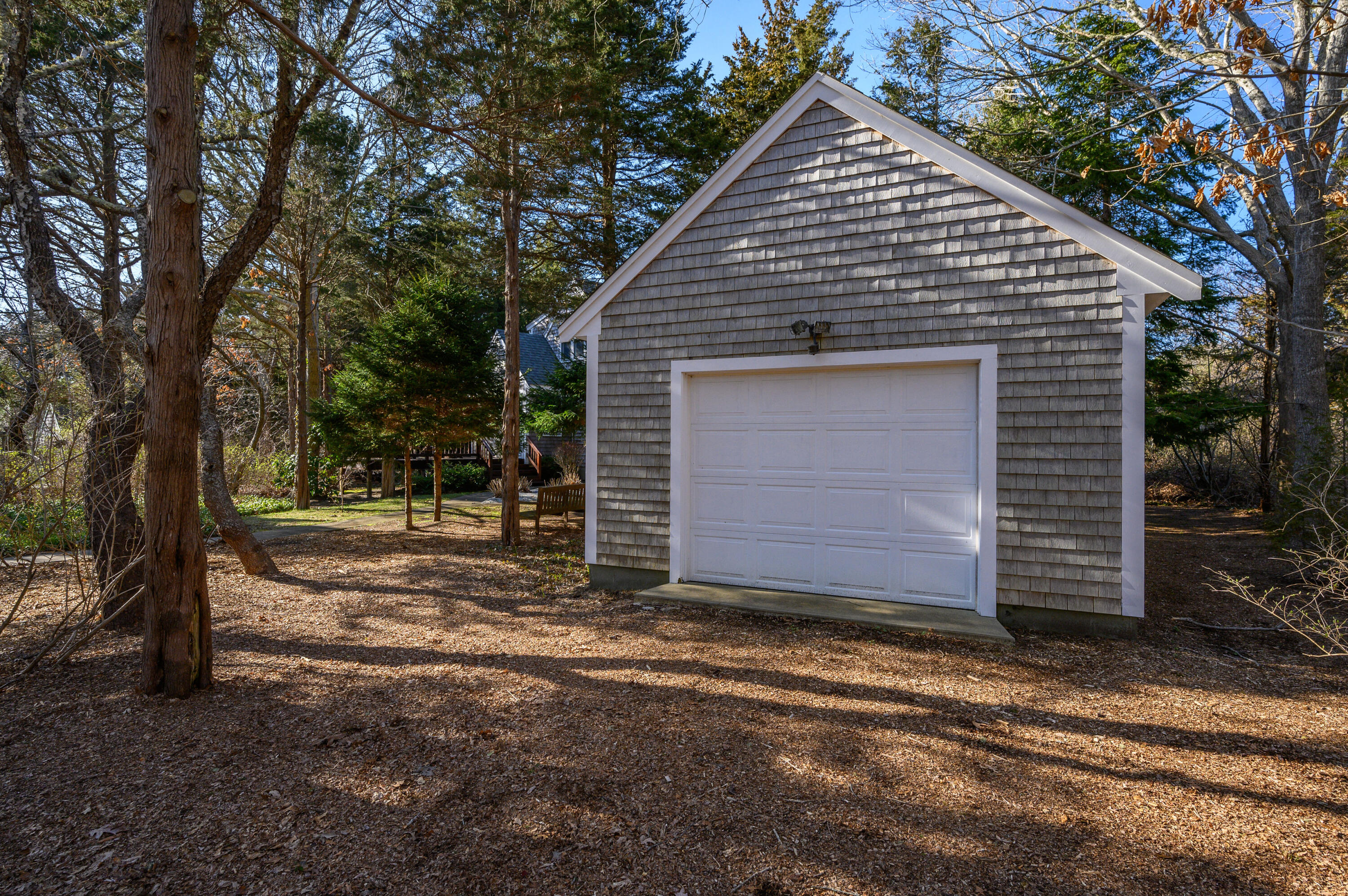 24 Blueberry Island Road Orleans, MA 02653 - Photo 4 of 39 a view of a house with a small yard and large tree