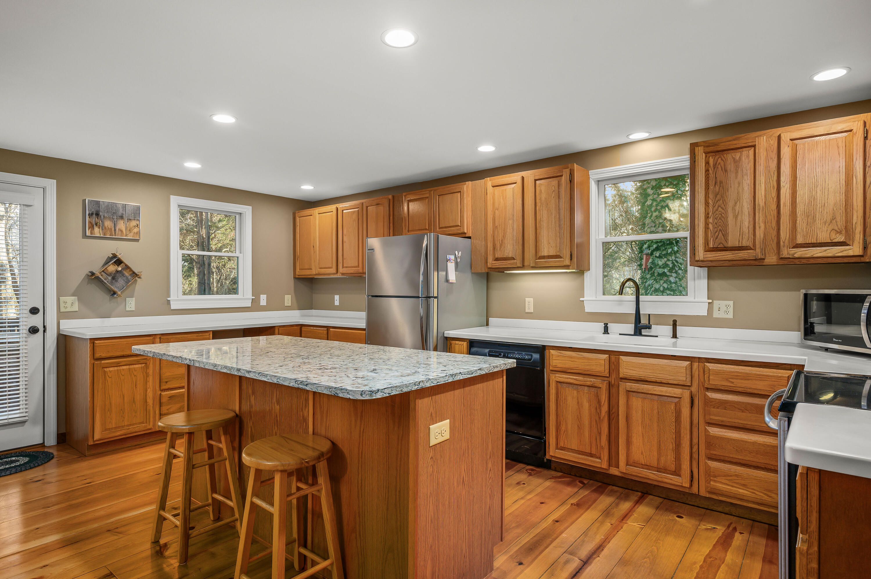 24 Blueberry Island Road Orleans, MA 02653 - Photo 5 of 39 a kitchen with stainless steel appliances granite countertop sink stove top oven and refrigerator