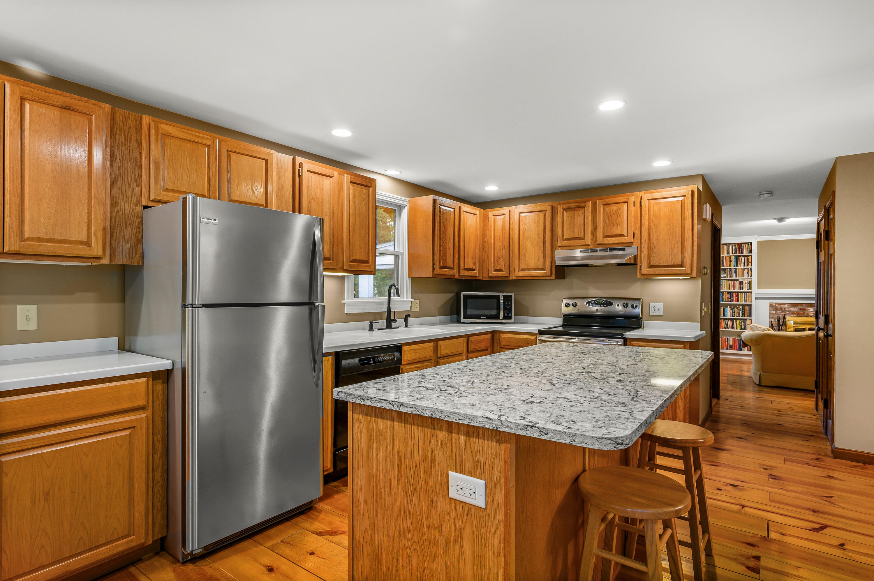24 Blueberry Island Road Orleans, MA 02653 - Photo 6 of 39 a kitchen with stainless steel appliances granite countertop a refrigerator a stove top oven a sink and dishwasher