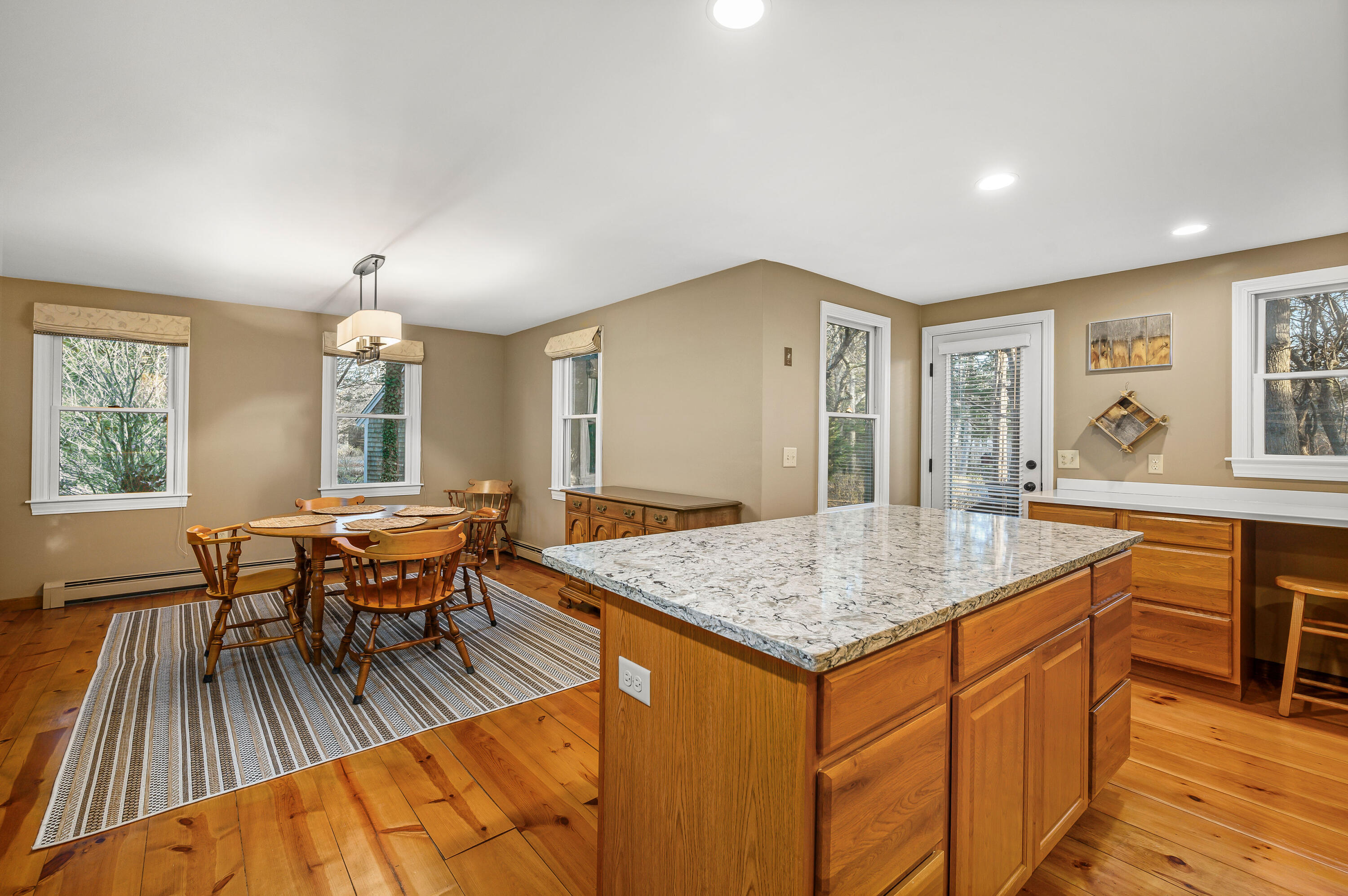 24 Blueberry Island Road Orleans, MA 02653 - Photo 8 of 39 a dining hall with stainless steel appliances granite countertop a stove and a sink