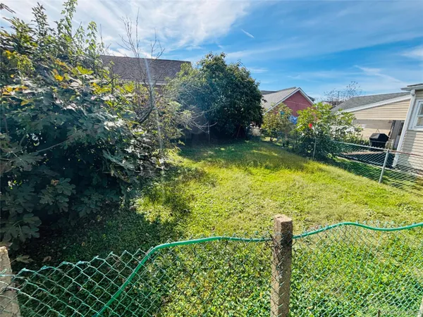 a swimming pool with some trees in the background