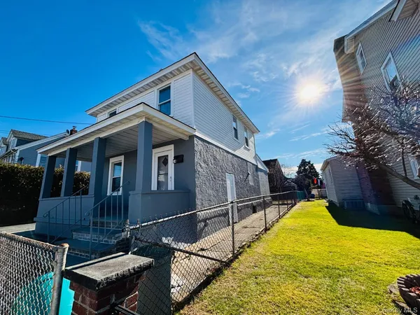 a view of a house with a wooden deck
