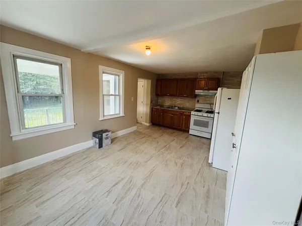 a room with furniture and a window