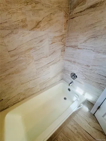 a bathroom with a bathtub