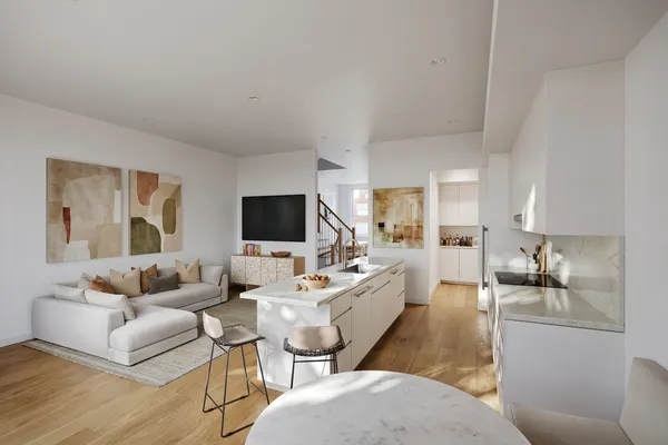 a living room with furniture wooden floor and a flat screen tv