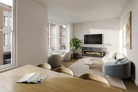 a bedroom with furniture and a flat screen tv