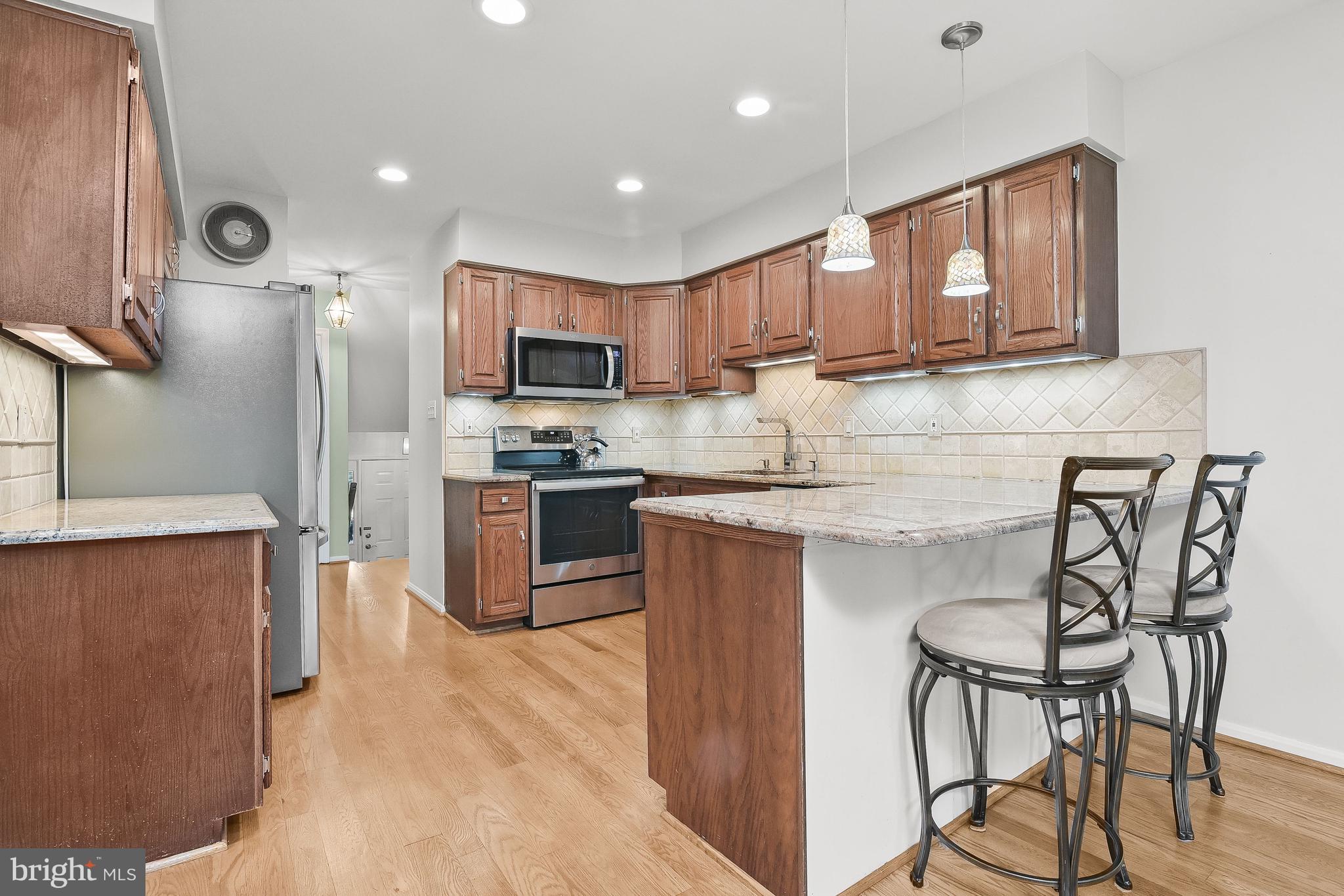 7369 Swan Point Way, Unit 109 Columbia, MD 21045 - Photo 4 of 65 Granite kitchen