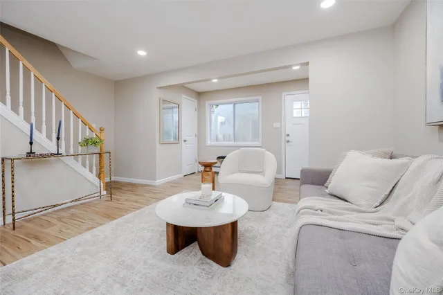 a living room with furniture and a table