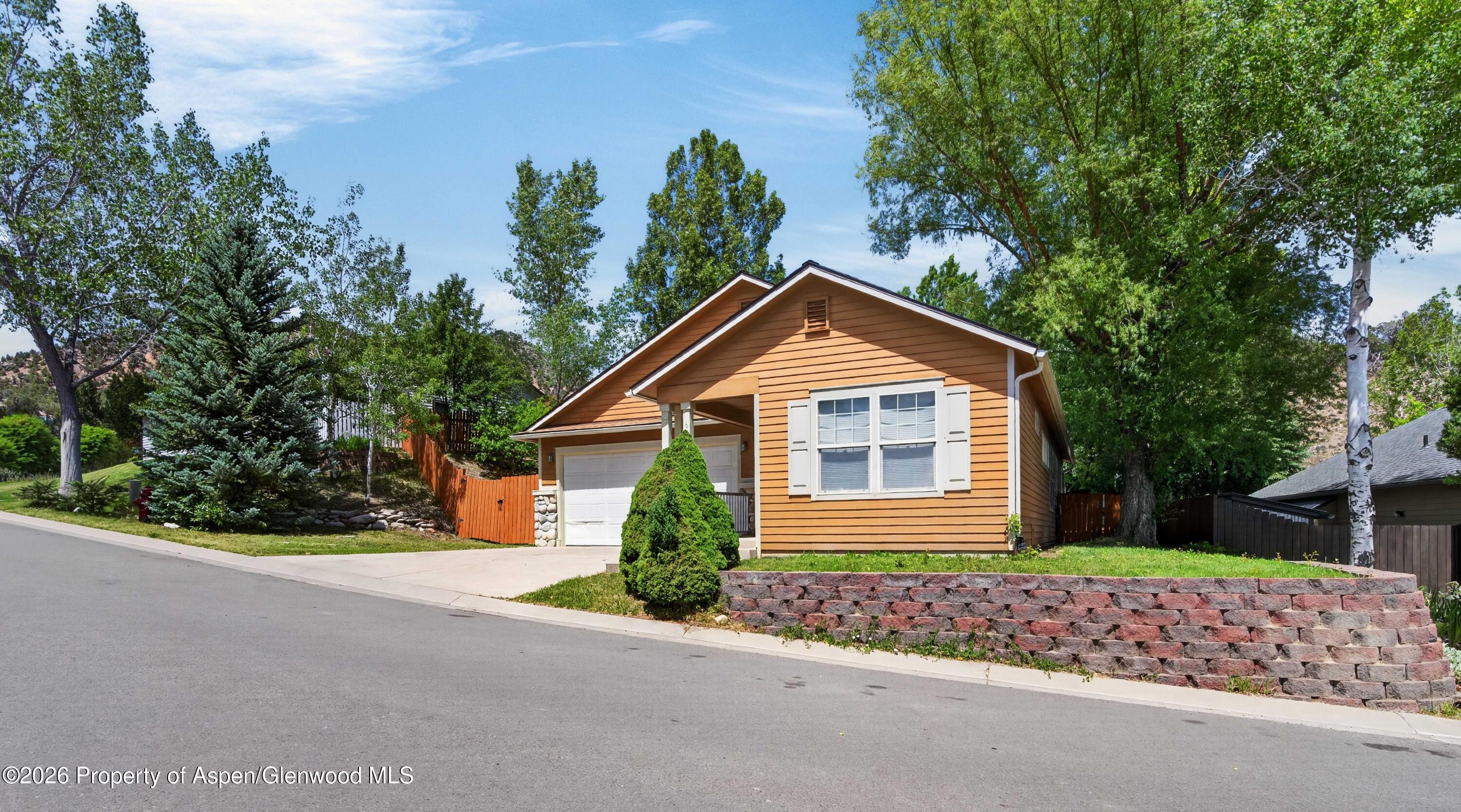 608 Lariat Loop New Castle, CO 81647 - Photo 2 of 32 a front view of a house with a yard