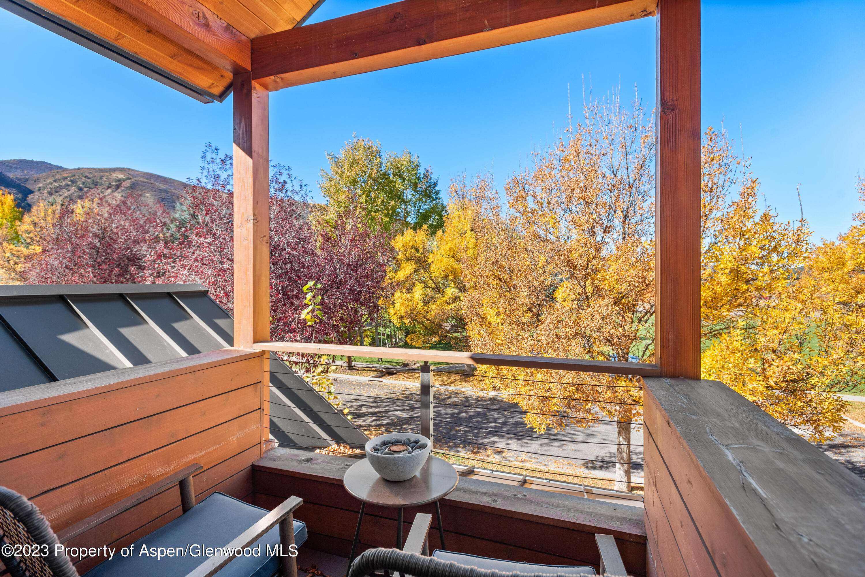 331 Branding Way Basalt, CO 81621 - Photo 11 of 28 a view of a balcony with wooden floor and outdoor seating