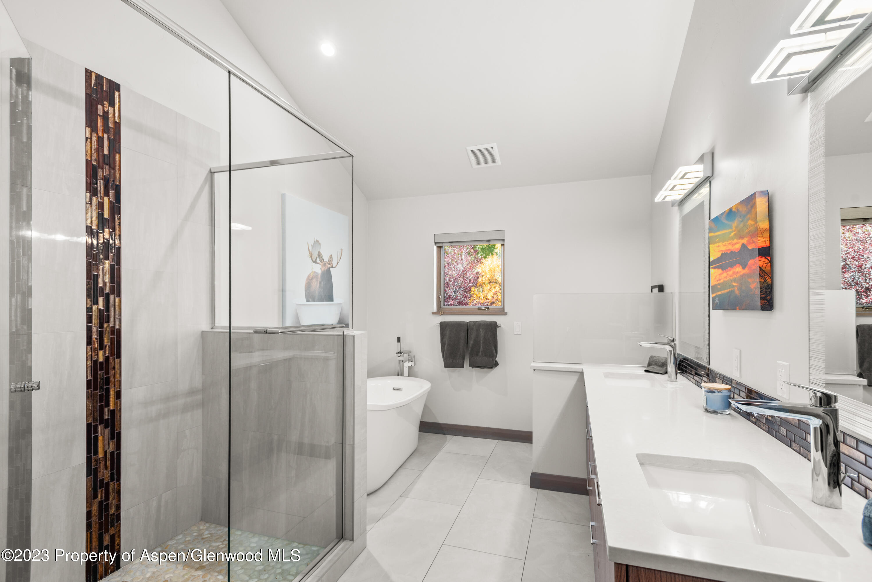 331 Branding Way Basalt, CO 81621 - Photo 12 of 28 a bathroom with a sink and mirror with bathtub