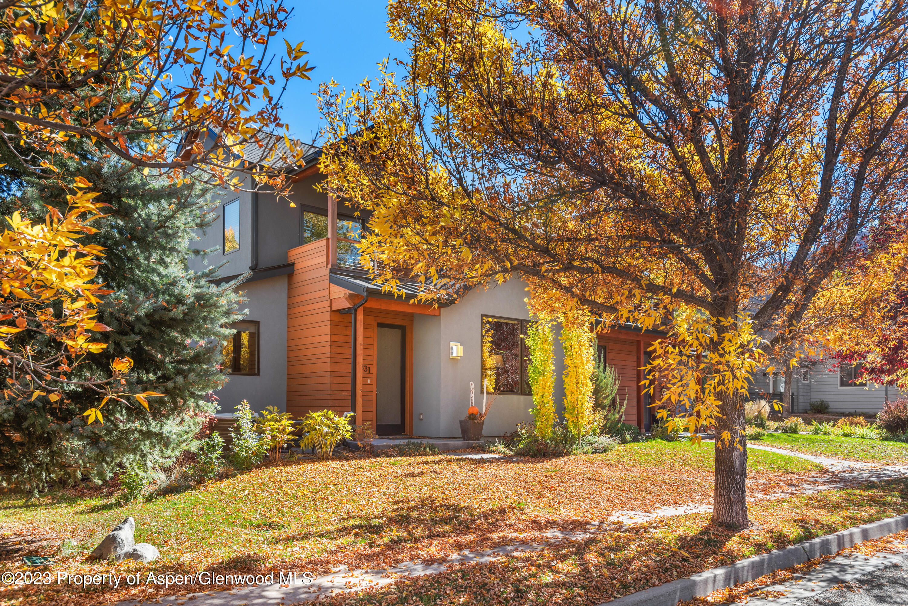 331 Branding Way Basalt, CO 81621 - Photo 25 of 28 a front view of a house with a yard covered with snow