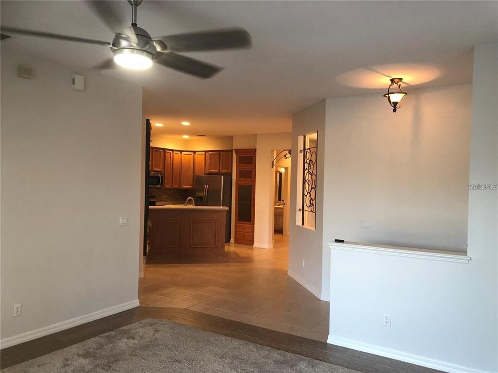 140 Shell Falls Drive Apollo Beach, FL 33572 - Photo 10 of 20 a view of a hallway with a chandelier