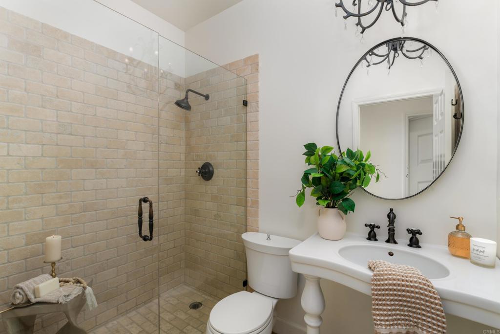 17543 Via Del Bravo Rancho Santa Fe, CA 92067 - Photo 20 of 41 a bathroom with a sink toilet and shower