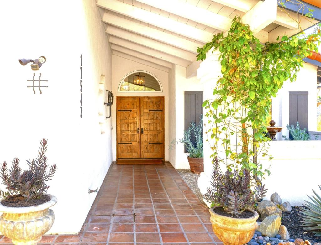 17543 Via Del Bravo Rancho Santa Fe, CA 92067 - Photo 22 of 41 a view of a entryway door of the house