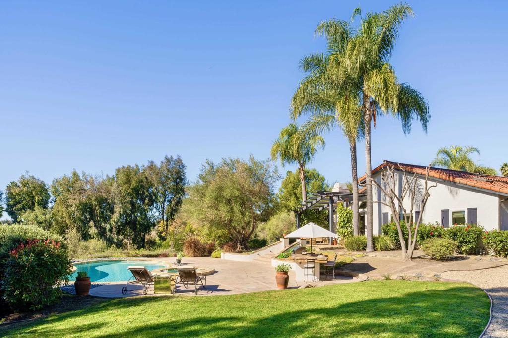17543 Via Del Bravo Rancho Santa Fe, CA 92067 - Photo 31 of 41 a view of a house with swimming pool and sitting area
