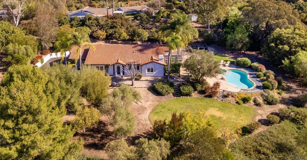 17543 Via Del Bravo Rancho Santa Fe, CA 92067 - Photo 34 of 41 an aerial view of residential house with swimming pool and lawn chairs