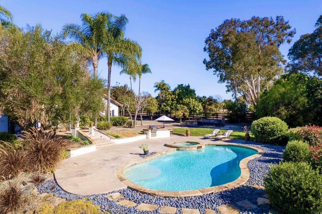 17543 Via Del Bravo Rancho Santa Fe, CA 92067 - Photo 36 of 41 swimming pool view with a garden space