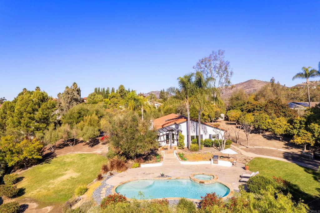 17543 Via Del Bravo Rancho Santa Fe, CA 92067 - Photo 37 of 41 a view of a swimming pool with an outdoor space and seating area