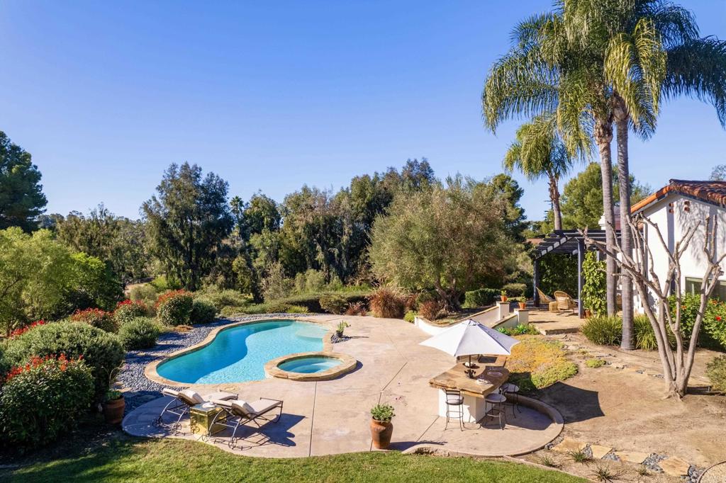 17543 Via Del Bravo Rancho Santa Fe, CA 92067 - Photo 38 of 41 a view of a swimming pool with lounge chairs
