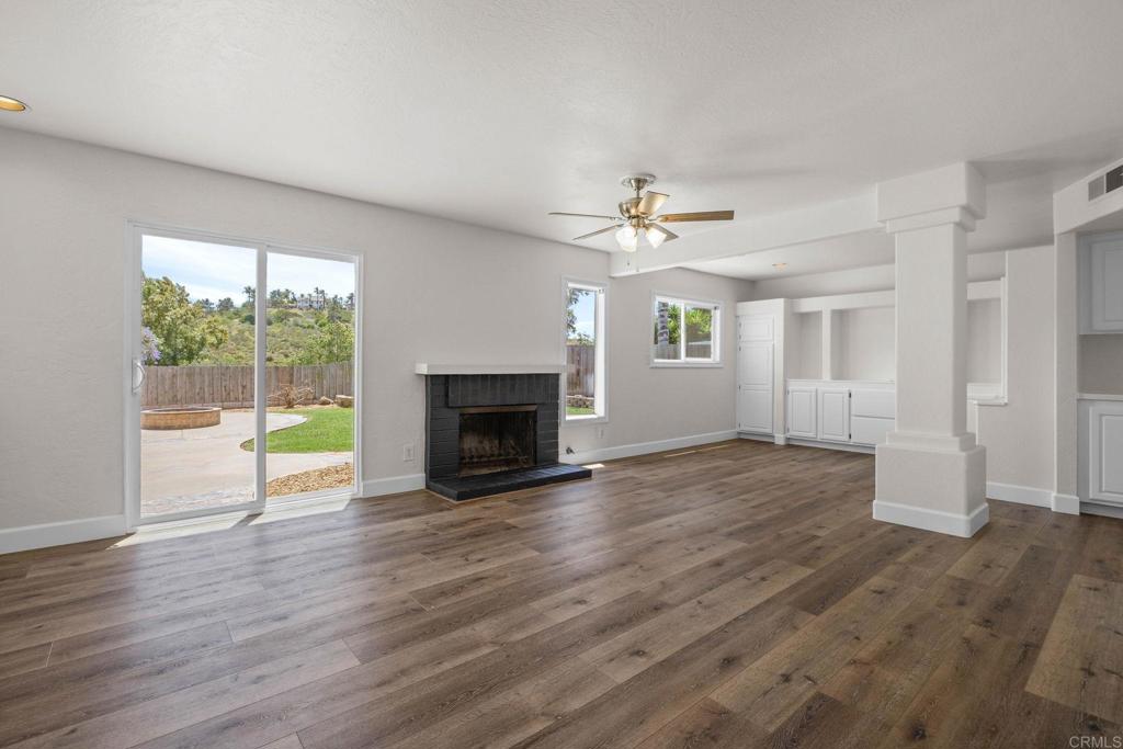4595 Blackwell Road Oceanside, CA 92056 - Photo 17 of 47 a view of an empty room with wooden floor and a window