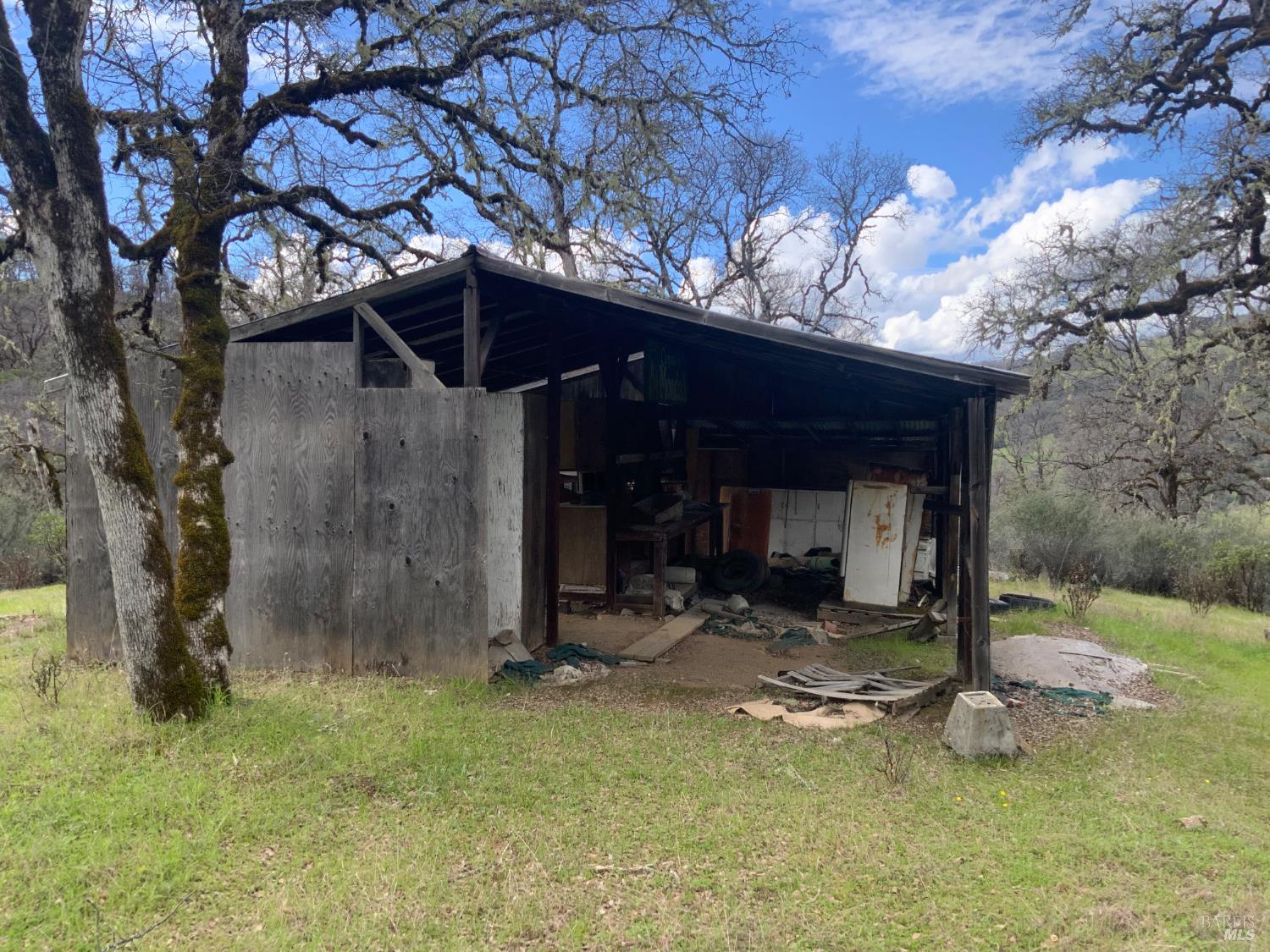 78500 Mexico Ridge Road Covelo, CA 95428 - Photo 15 of 17 a view of a house with a small yard