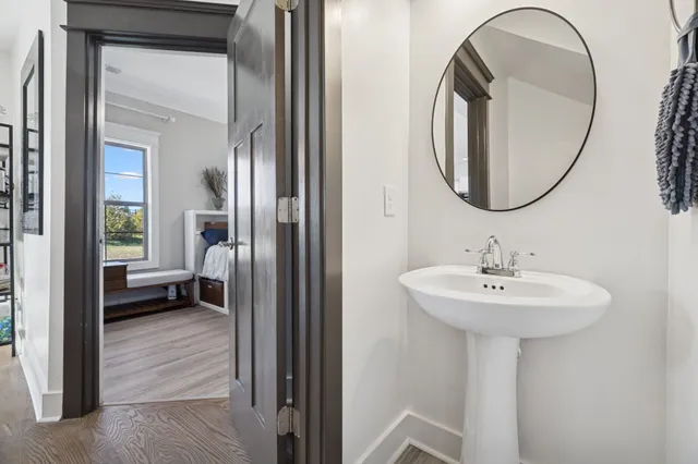 a en suite bathroom with a sink and a mirror