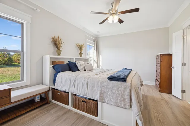 a bedroom with bed and window