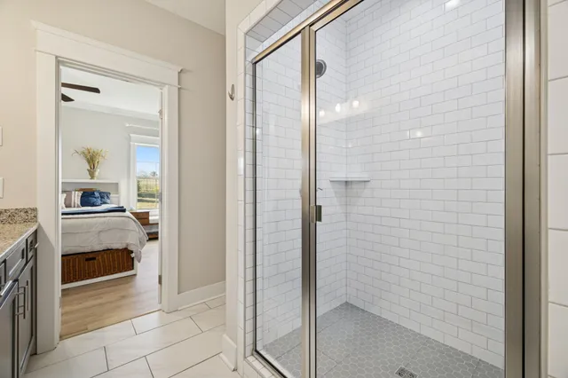a bathroom with a shower and a sink